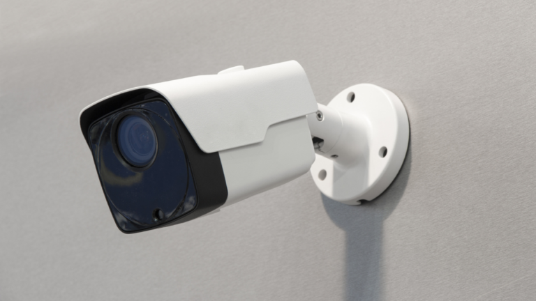 Wireless camera being installed on the side of a building